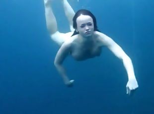Three ladies get naked swimming in the ocean