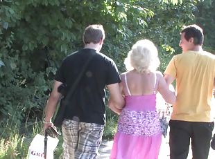 Granny and a couple of college guys have a threesome in the woods