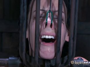 Brunette slave tied facing down when tortured in BDSM