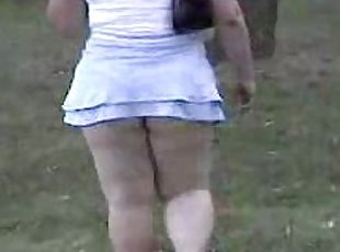 Chubby girl in extremely short skirt gets caught on a spy cam