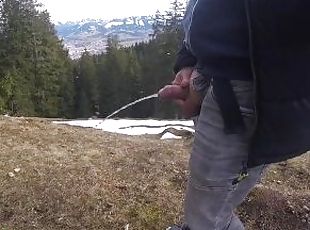 While hiking in the mountains I had to piss, then I jerked my cock with pleasure