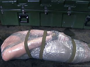 Skinny slave with small tits inserted in polythene in BDSM porn