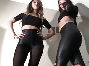 2 girls teasing in liquid leggings