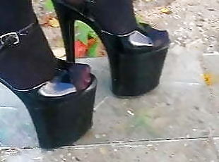 Lady L walking xtreme high heels glas road.(video short ver)