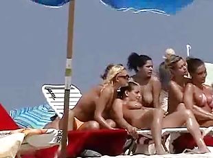 Nude beach hotties get filmed with a hidden cam while having rest