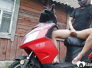 Biker girl masturbates on her red motorcycle