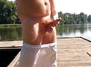 Hairy Ginger playing with dick at the river and on the dock