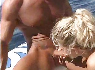 Sexy blonde on a boat loves eating dick