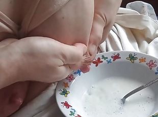 Russian MILF drains lactation milk into a plate