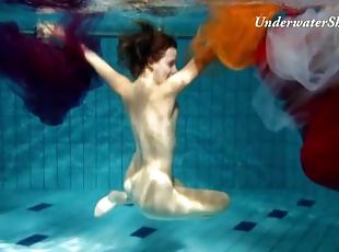 Artful naked underwater show with a hairy pussy girl