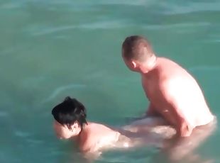 Curvy couple has hardcore sex in the ocean