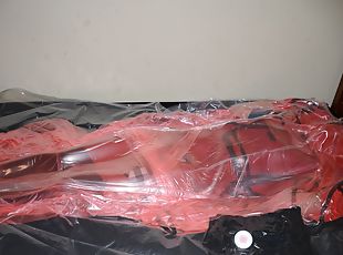 Mar 2 2023 - VacPacked in my long red raincoat under my PVC aprons and pink PVC sack