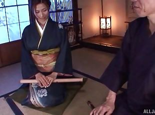 Gorgeous Japanese MILF in traditional clothing receives a hot facial