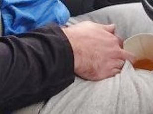 girlfriend drinks a big cup of very yellow piss in car.