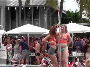 Topless dancing amateurs at a pool party