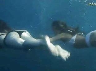 Bikini girls filmed underwater in the ocean