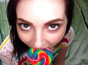 Lollipop licking teen girl sucks on a cock