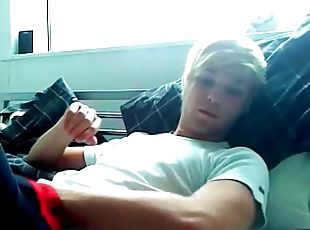 Smooth blonde boy cums on his stomach