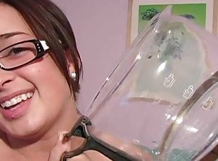 Busty brunette wearing glasses put a dildo in her wet hole